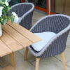 Cologne Spring zestaw stołowy ogrodowy 6-8 osobowy szare plecione krzesła tarasowe drewniane teakowe nogi Twojasiesta designerskie meble ogrodowe